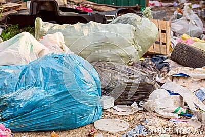 Many garbage and waste bags outdoors. Ecology and nature damage concept Stock Photo