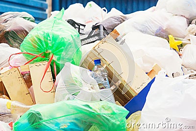 Many garbage and waste bagsin container. Ecology and nature damage concept. Stock Photo