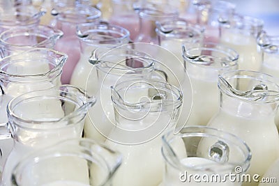 Many glass jugs with milk and yogurt Stock Photo