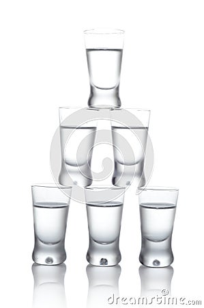 Many glasses of vodka isolated on white background Stock Photo