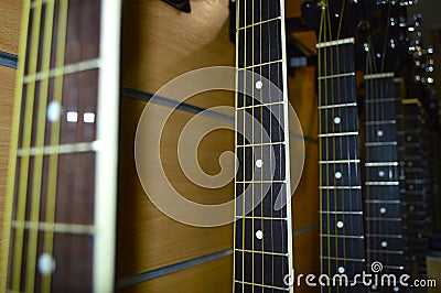 Many guitars in a row Stock Photo