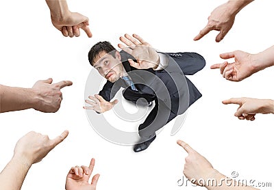 Many hands are pointing and blame stressed man. View from above. Isolated on white background Stock Photo