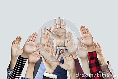 Many hands raised together Stock Photo