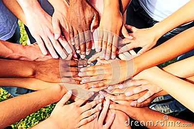 Many hands together: group of people joining hands Stock Photo