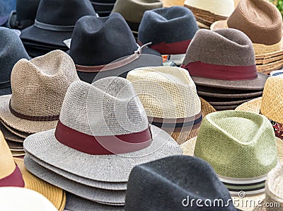 Many hats for men in different shapes and colors in one display for sale Stock Photo