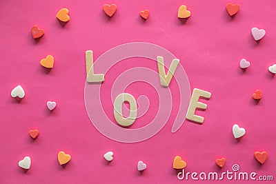 Many hearts with word LOVE on pink background, Love icon, valentine`s day, relationships concept Stock Photo