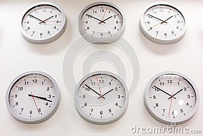 Many hours show different times Stock Photo