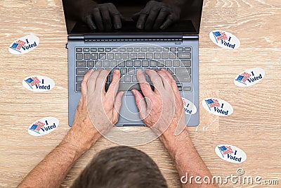 Many I Voted stickers on desk of hacker Stock Photo