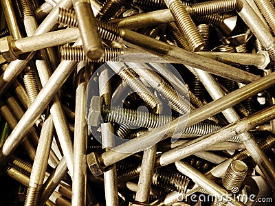 Many iron fasteners laying on top of each other in a pile Stock Photo