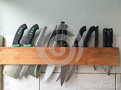 Many large knife hanging wooden storage knife Stock Photo