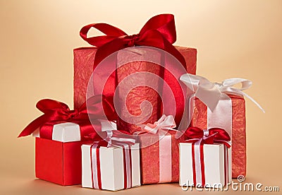 Many large and small Christmas gifts on beige Stock Photo