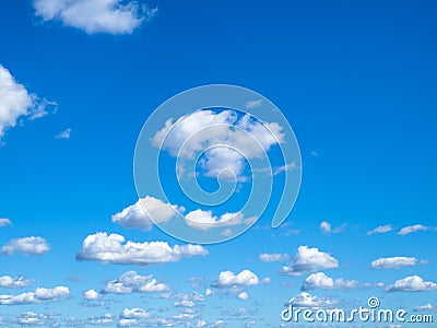 Many little puffy clouds in blue sky in sunny day Stock Photo