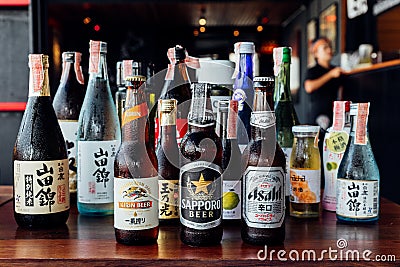 Many major and minor brands of Japanese liquors are including beer, sake, spirits and umeshu in Japanese restaurant Editorial Stock Photo