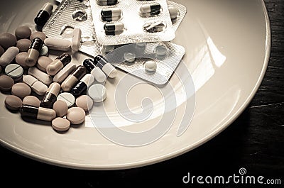 Many medications are dishes for the sick who could be administered to food - sepia tone Stock Photo
