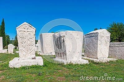 Many monumental medieval tombstones lie scattered in Herzegovina Stock Photo