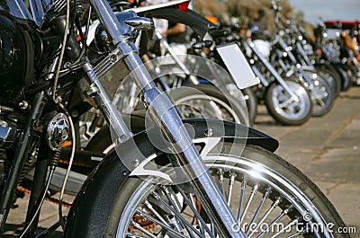 Many motorcycles lined up Stock Photo