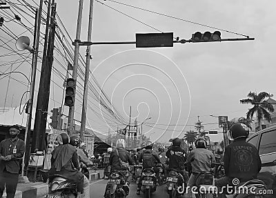 Many motorcyclists are stopping at traffic lights Editorial Stock Photo