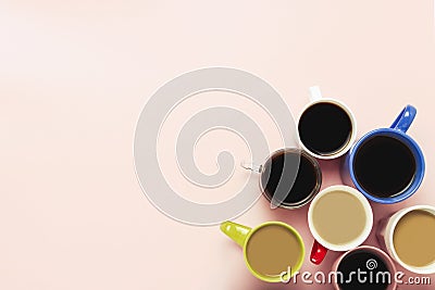 Many of multi-colored cups of coffee and coffee drinks on a pink background. Concept breakfast with coffee, coffee with friends. Stock Photo