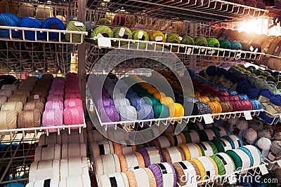 Many multi-colored threads on the shelf Stock Photo