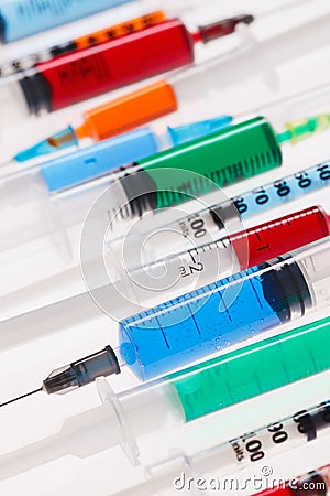 Many multicolor syringes Stock Photo