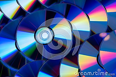 Many musical compact discs with a rainbow spectrum of colors as a bright background Stock Photo