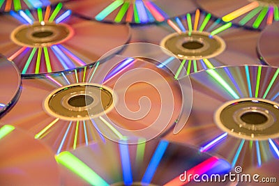 Many musical compact discs with a rainbow spectrum of colors as Stock Photo