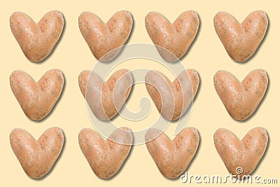 many natural heart-shaped potato Stock Photo