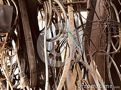 Many old different used electrical cables and wires hanging background Stock Photo