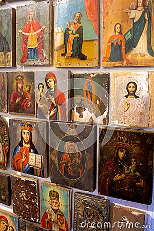 Many old icons. Orthodox icon. Image of the Saints. Virgin Mary and others. Painting, drawing on wood. Vintage and retro Editorial Stock Photo