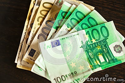 Many one hundred Euro bills resting on table 2 Stock Photo