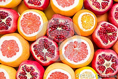 Many opened fruits at a market in Istanbul, Turkey during sunny day. Nice natural background with pomegranates, oranges and grape- Stock Photo