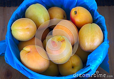 Many organic peaches fruit basket at the market Stock Photo