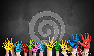 Many painted kids hands with smileys Stock Photo