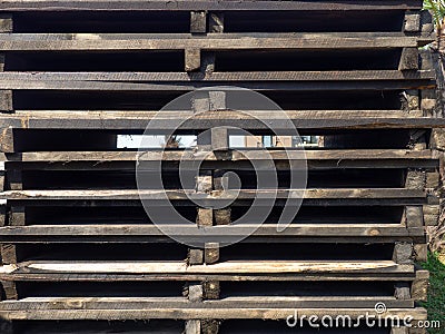 Many pallets painted in black. Lots of broken boards. Industrial Zone. Loading Stock Photo