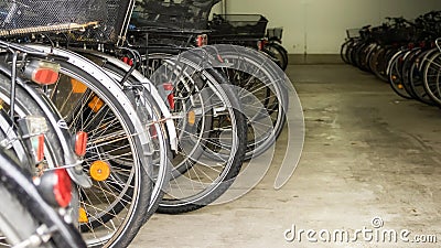 Many parked bicycles in a garage Stock Photo