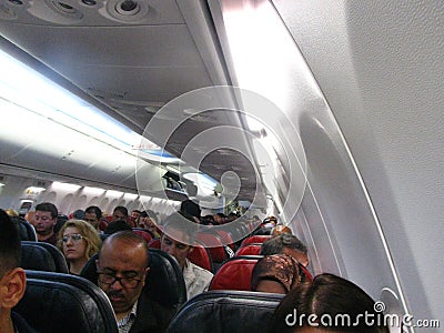 Passengers Sitting On Seats in An Aircraft Editorial Stock Photo