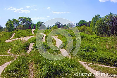 Many paths of different directions on the green hills Stock Photo