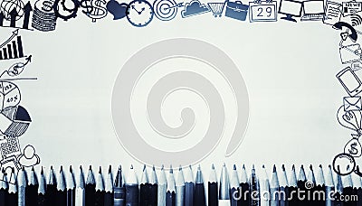 Many pens and pencils with business drawing icons around border. Stock Photo