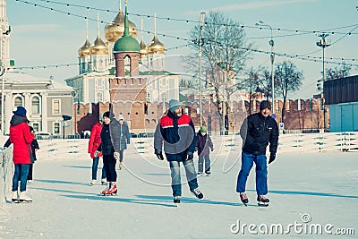 Many people in the city skating rink on the central square in the background of the Tula Kremlin. Winter in Russia. Editorial Stock Photo