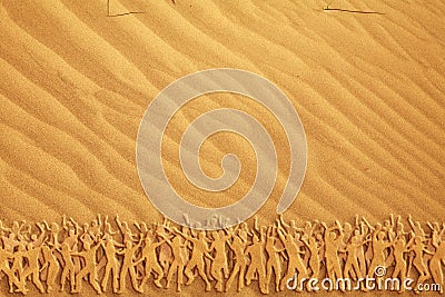Many people dancing on the sand Stock Photo
