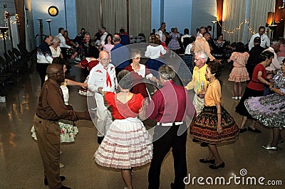 Several people enjoy square dancing Editorial Stock Photo
