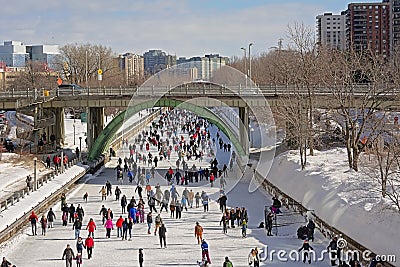 Many people ice skating on rideau canal skateway during the winterlude festival in Ottawa Editorial Stock Photo