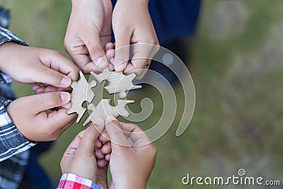 Many persons holding pieces of jigsaw puzzle,Teamwork concept,,Business connection,Success and strategy concept,Business accountin Stock Photo