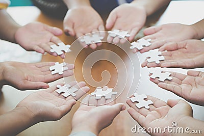 Many persons holding pieces of jigsaw puzzle,Teamwork concept,,Business connection,Success and strategy concept,Business accountin Stock Photo