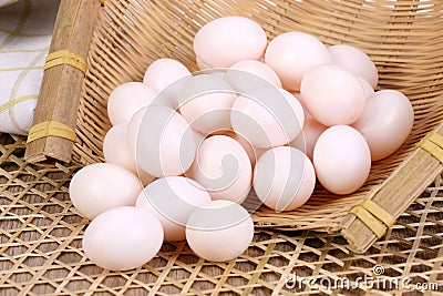 Many pigeon eggs in bamboo basket Stock Photo