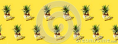 Many pineapples on a solid yellow background pattern Stock Photo