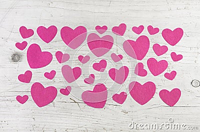 Many pink hearts on wooden shabby chic white background for vale Stock Photo