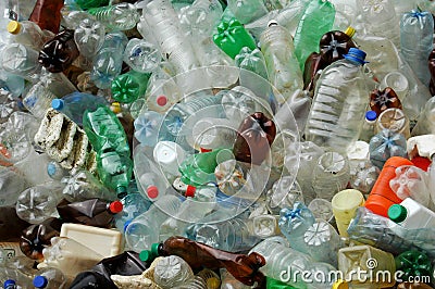 Many plastic bottles thrown outdoor near water Stock Photo