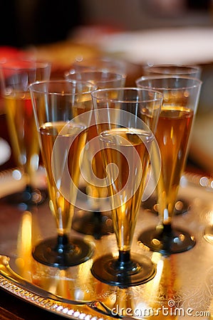 Many plastic glasses with apple juice. healthy party catering. kids catering concept Stock Photo