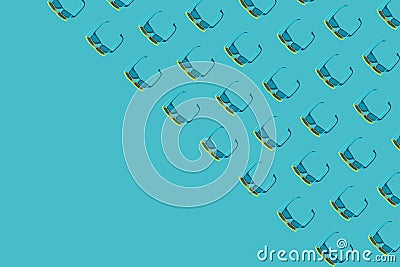 Many plastic sunglasses pattern on turquoise blue background with copy space Stock Photo